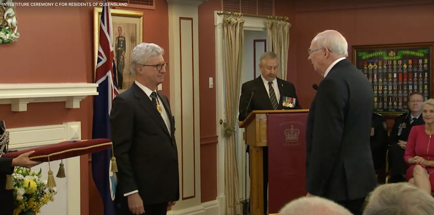 Rod Campbell being presented with his award in the official ceremony at Government House, Townsville