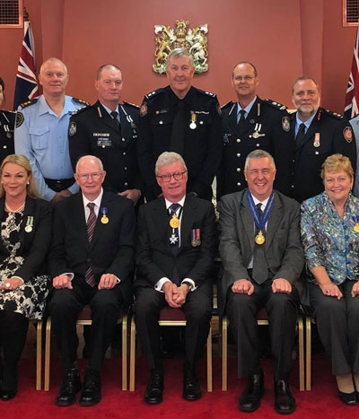 Rod Campbell (front and second from left) in a detail fomr the official award ceremony photo