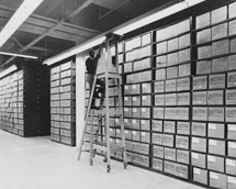 Archivist at work in records centre (washington, public domain image via Wikimedia Commons))