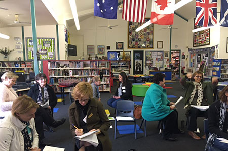 PL session under flags in a school library